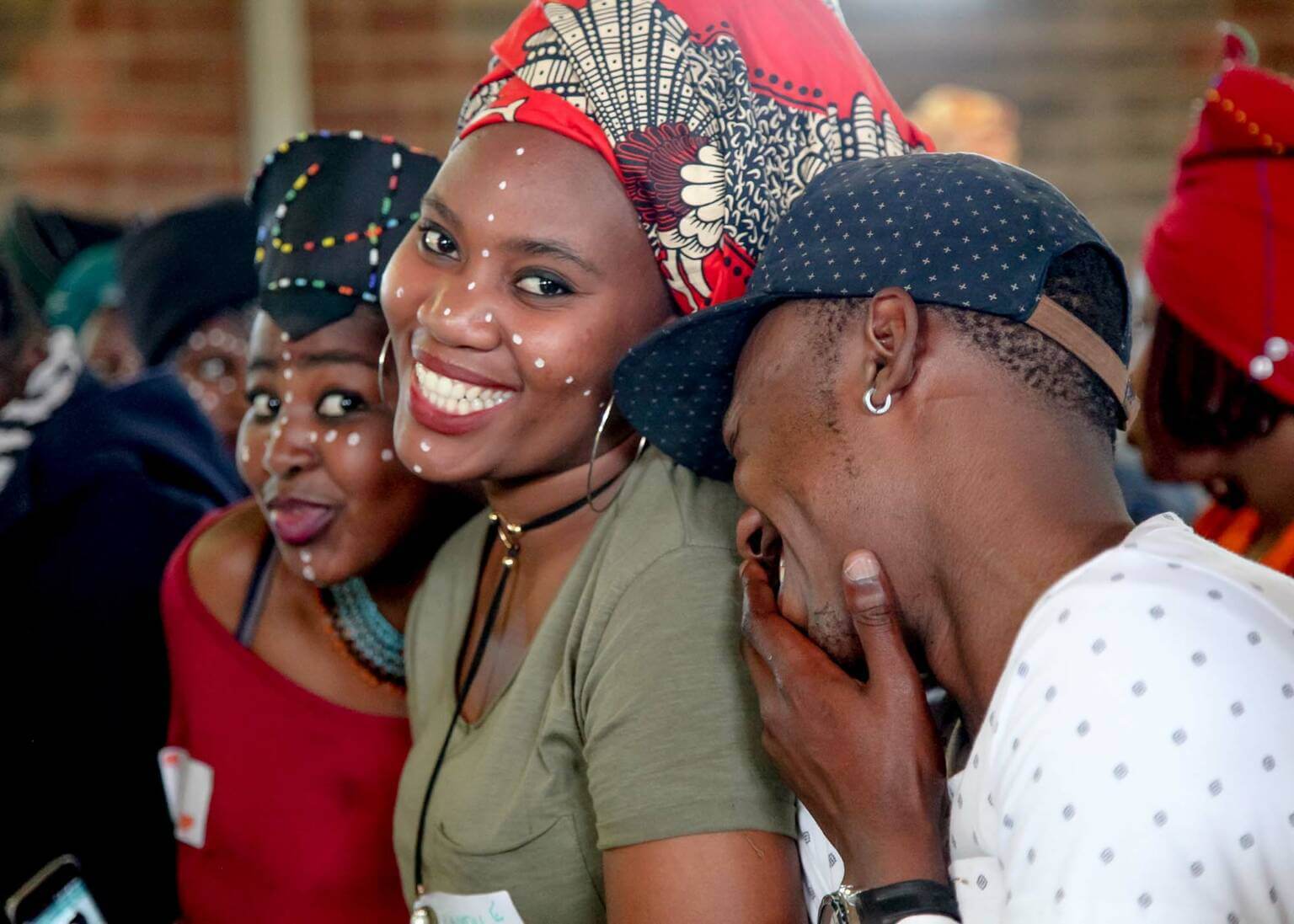 Three happy, smiling young people