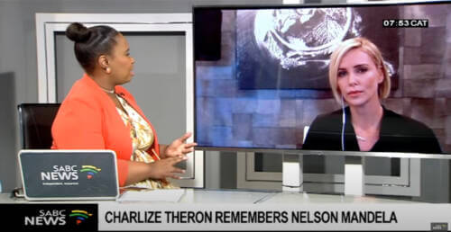 News corespondent interviewing Charlize Theron