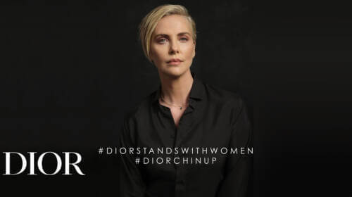 Photo of Charlize Theron with text that reads #DIORSTANDSWITHWOMEN #DIORCHINUP